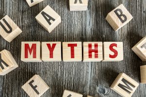 letter blocks in red in and black. Red letters spell MYTHS