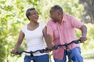 Black Man and Women riding bicycles