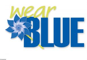 Text says " Wear Blue". A pin wheel is coming out of the B.