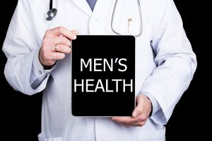 Doctor holding a sign that says " Men's Health"