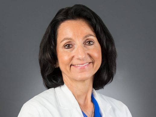 Picture of Desiree Soter-Pearsall, MS, M.D. in white lab coat