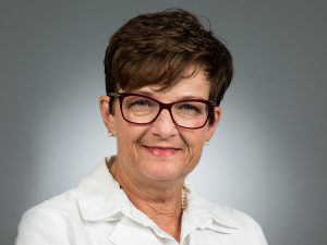Picture of Lisa B Burch, MD in white shirt and white lab coat