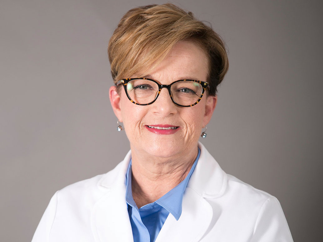 Picture of Lisa B. Burch, M.D. in a white lab coat
