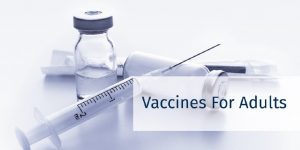 "Vaccines for Adults" Syringe and medicine bottles laying down