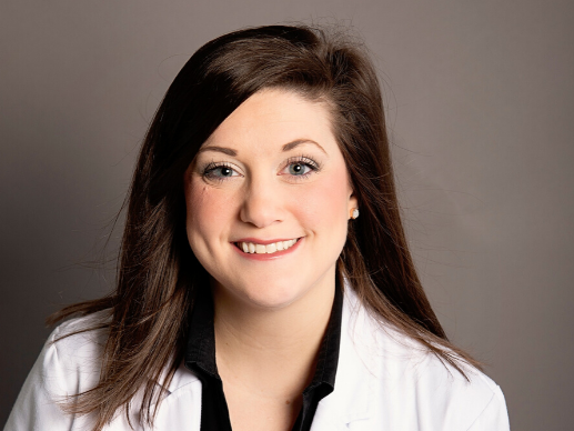 Morgan Rutledge CRNP of Alabama Medical Group Infectious Disease Practice wearing white lab coat and smiling