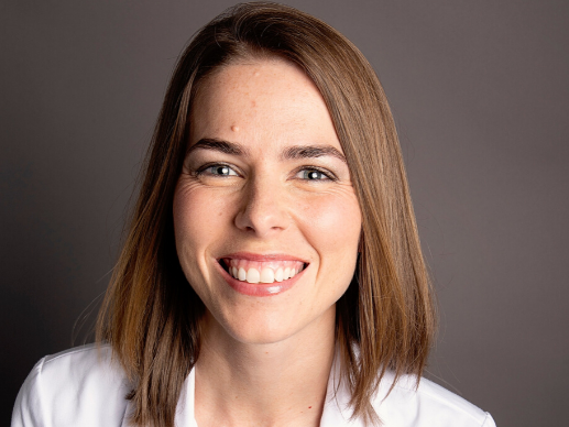 Tawny Lewis CRNP at Alabama Medical Group in Infectious Disease wearing a white lab coat and smiling